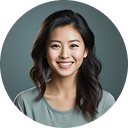 Portrait of a smiling Asian woman with long dark hair wearing a sage green blouse against a gray background