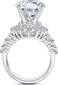 Silver engagement ring with a large heart-shaped central diamond surrounded by smaller round diamonds along the band.