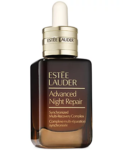 Brown glass bottle with gold dropper top labeled Estee Lauder Advanced Night Repair skincare serum
