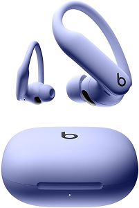Light purple wireless earbuds with ear hooks and matching charging case, featuring the Beats logo on both earbuds and case.
