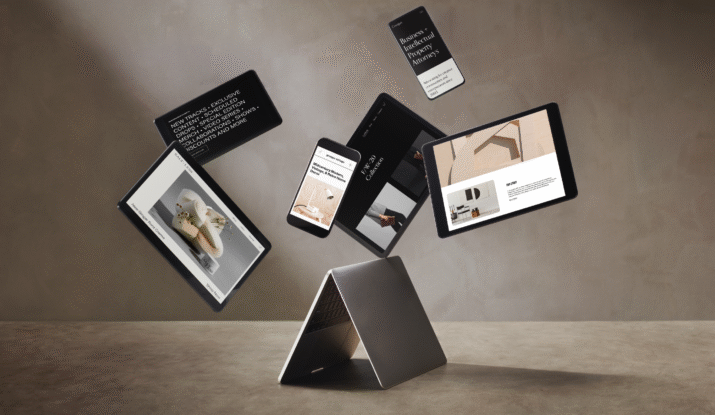 A partially closed laptop standing on a surface with five floating devices above it displaying various websites including a foot cream ad, business intellectual property attorneys, a midcentury modern home decor site, and an FW20 collection page, all against a plain brown background.