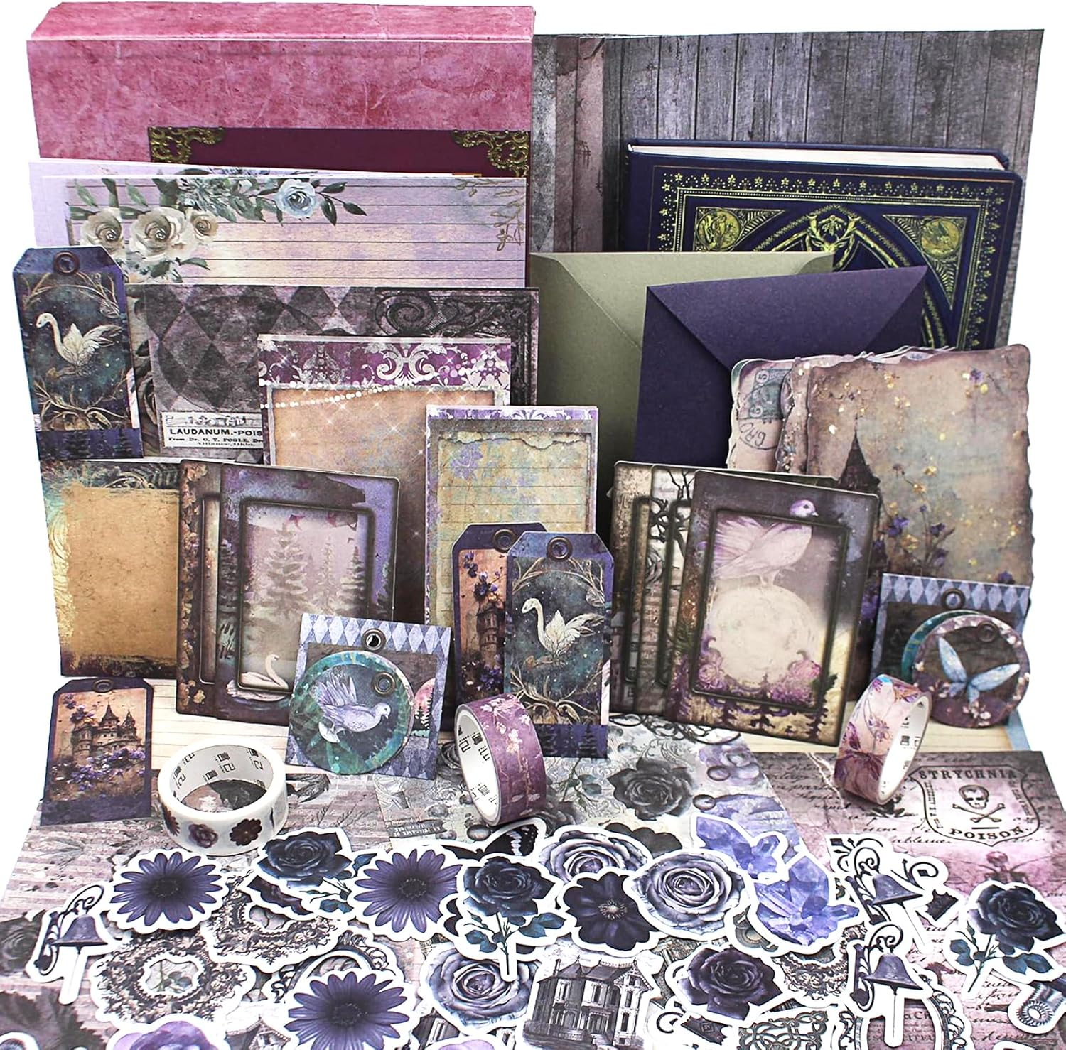 A collection of vintage-style stationery including decorative papers, envelopes, tags, stickers, and washi tapes featuring floral, bird, and mystical motifs in purple, blue, and beige tones.