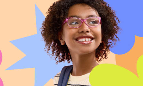 Young girl with curly hair wearing pink glasses and a striped shirt, smiling and looking to the side, against a colorful abstract background of star and flower shapes.