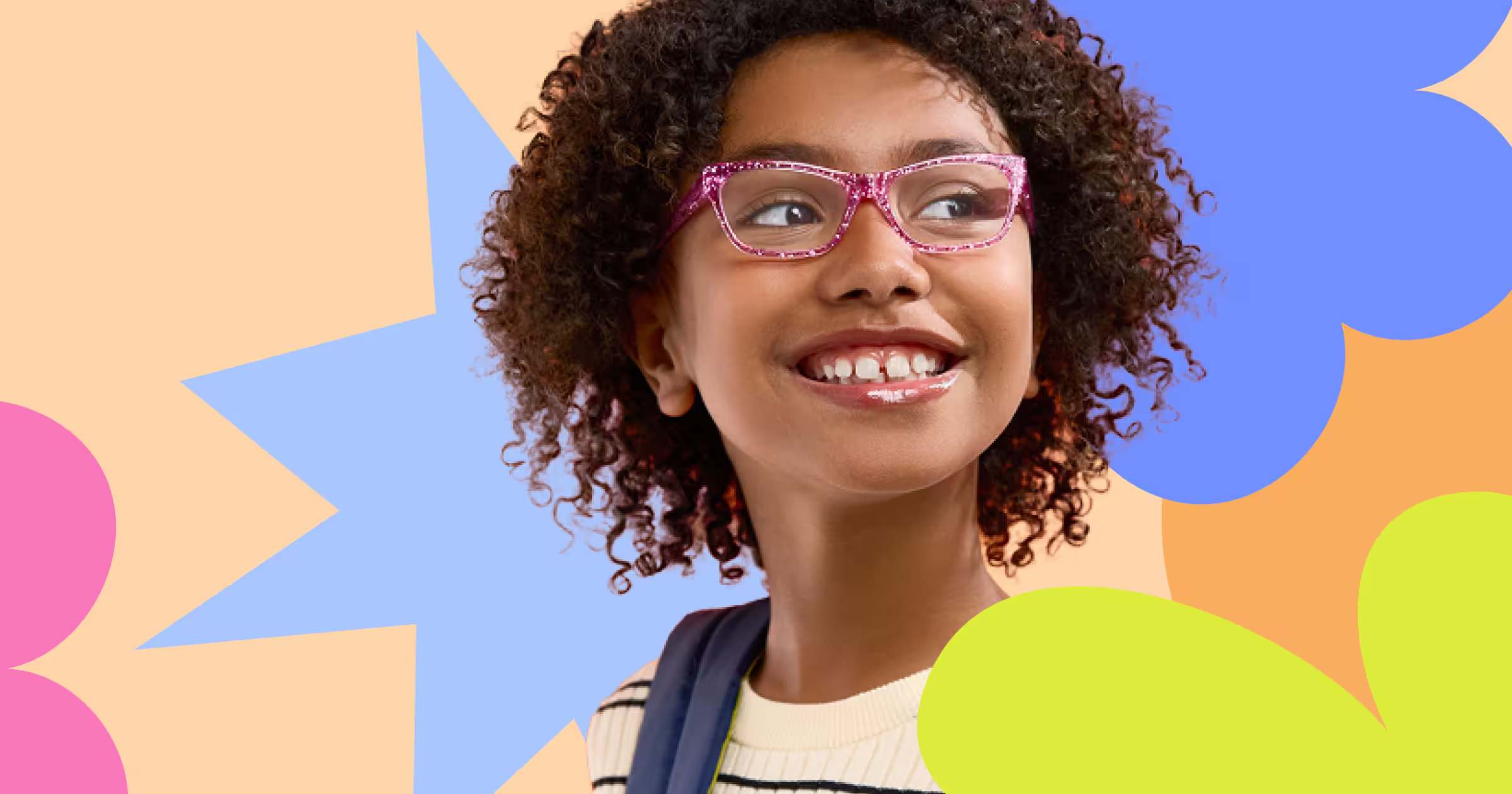 Young girl with curly hair wearing pink glasses and a striped shirt, smiling and looking to the side, against a colorful abstract background of star and flower shapes.