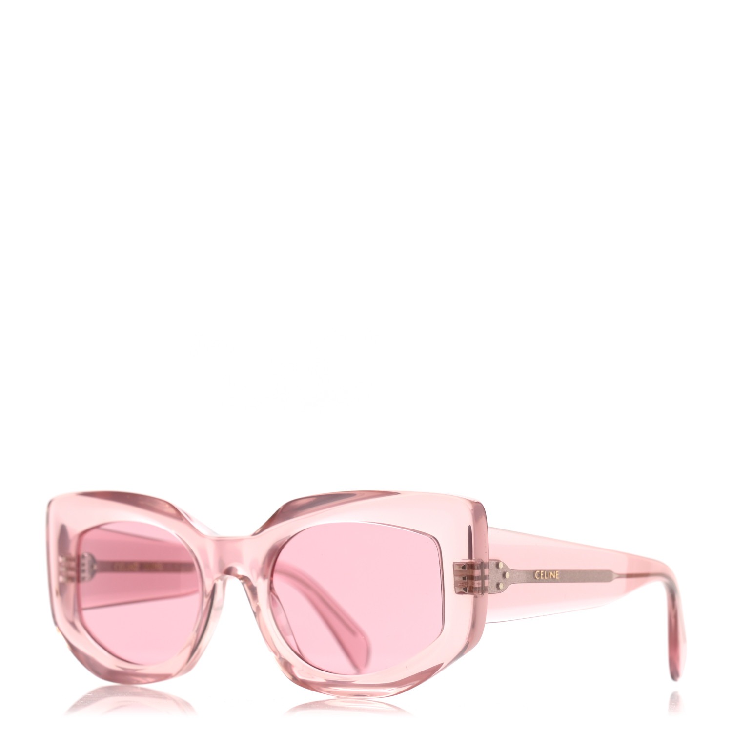 Pink oversized cat-eye sunglasses with translucent frames and matching tinted lenses, featuring a subtle brand name on the temple.