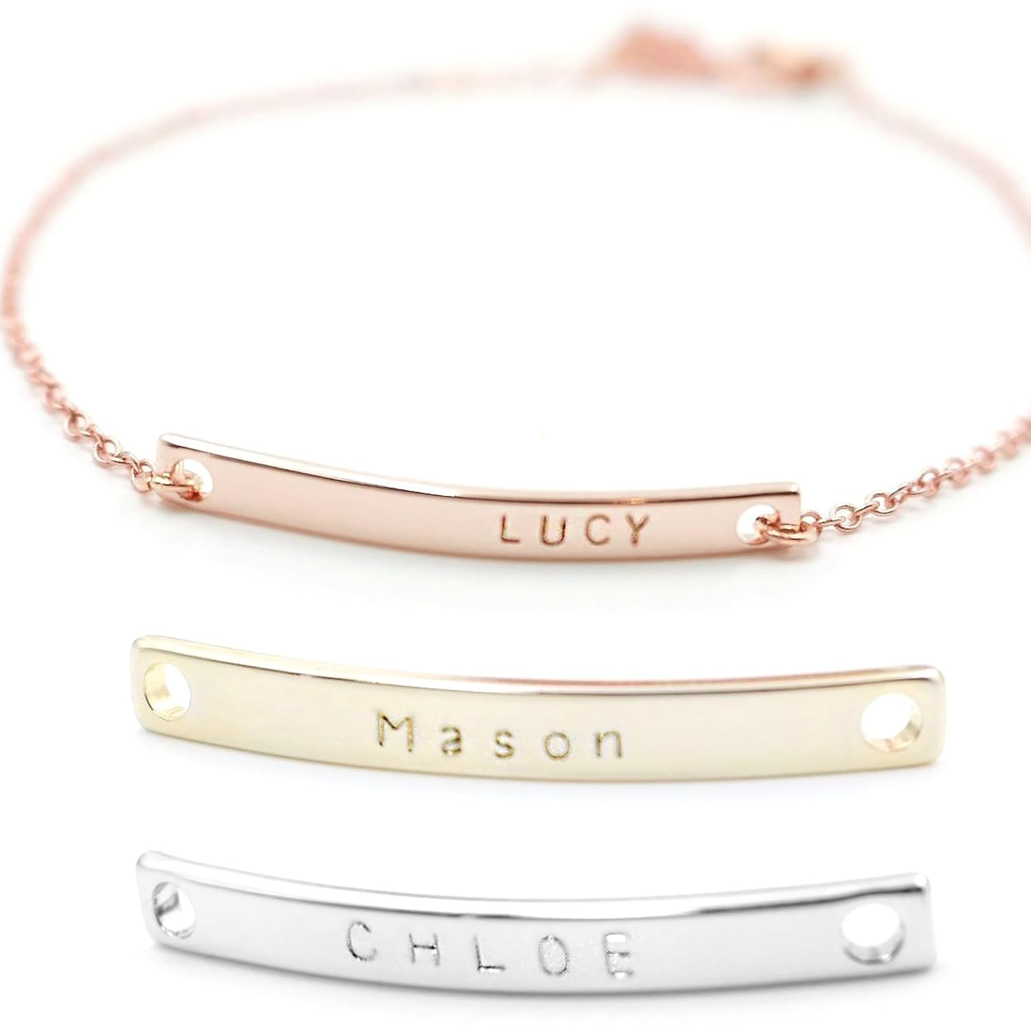 A rose gold bar bracelet engraved with the name Lucy and two metal bar nameplates underneath engraved with Mason and Chloe.