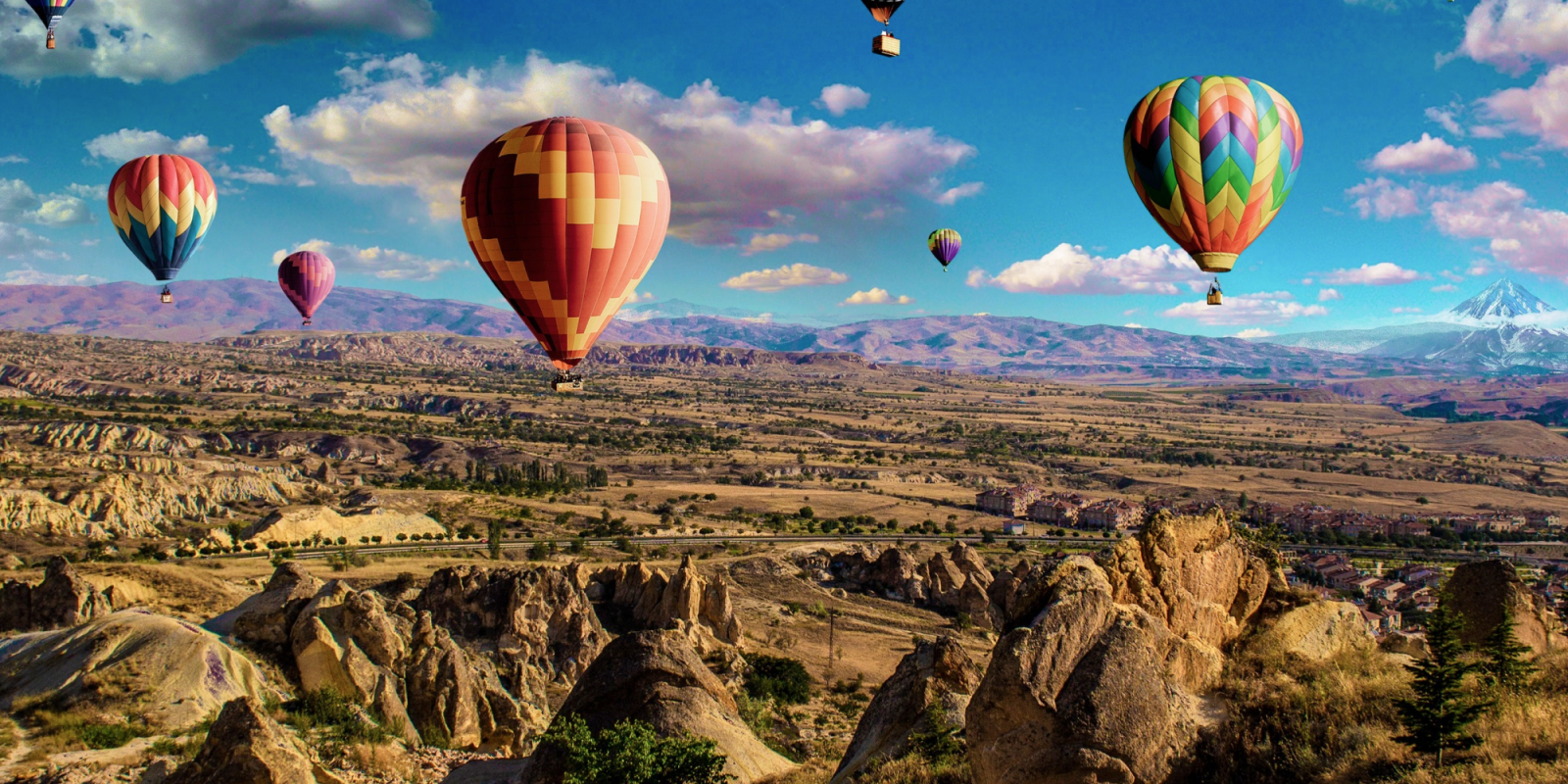 Hot Balloons 2000×2000 Colorful hot air balloons over rocky landscape and mountains